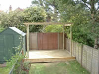 Softwood decking set on the diagonal and pergola